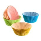 Blue green yellow orange muffin cups and cupcakes